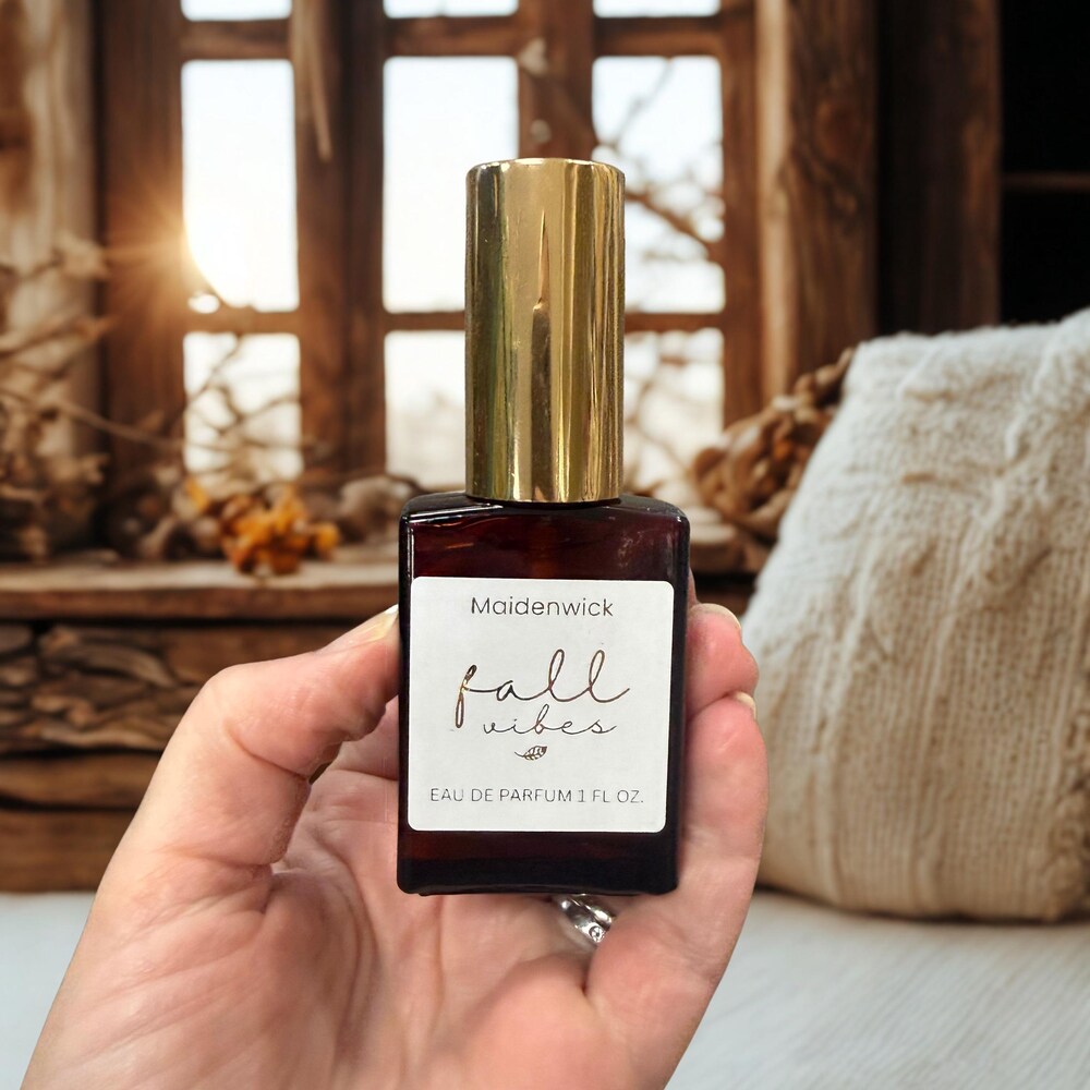 Fall Vibes eau de parfum in an amber glass bottle with a gold cap